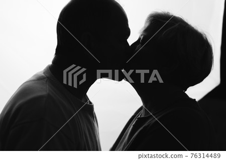 Elderly couple hugging in black and white colors. Happy loving caring people. Caucasian retired man Elderly couple hugging in black and white colors. Happy loving caring people. Caucasian retired man 76314489