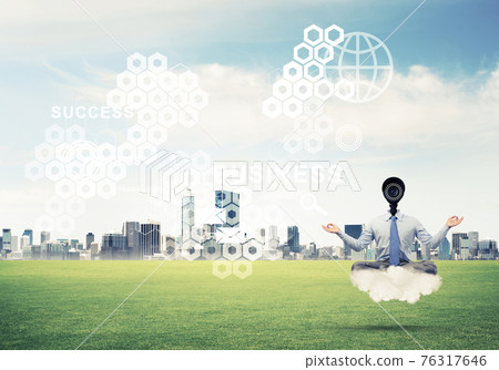 Camera headed man sitting in lotus pose on cloud against modern 76317646