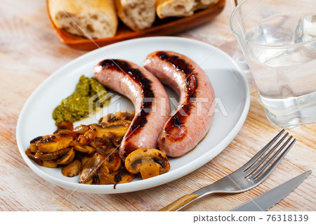 Grilled sausages with mushrooms Grilled sausages with mushrooms 76318139