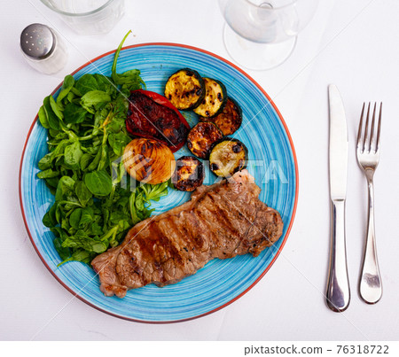 Beef with grilled eggplant, onion, tomatoes and fresh greens Beef with grilled eggplant, onion, tomatoes and fresh greens 76318722