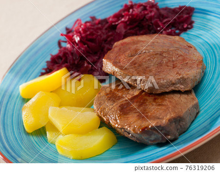 Roasted veal hip with boiled potato 76319206