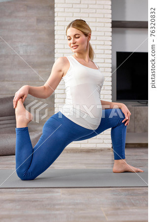 flexible lady in sportswear engaged in workout at home, stretch the body, train body muscles flexible lady in sportswear engaged in workout at home, stretch the body, train body muscles 76320832