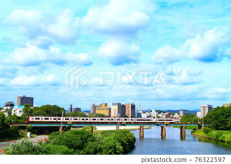 Okazaki cityscape and Meitetsu train scenery 76322597
