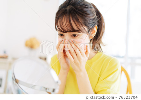 A woman wearing a mask 76323704
