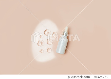 Pipette serum bottle dose of fluid hyaluronic acid with gel drops on neutral beige background. Cosmetics concept. Flat lay, copy space, dermatology beauty concept Pipette serum bottle dose of fluid hyaluronic acid with gel drops on neutral beige background. Cosmetics concept. Flat lay, copy space, dermatology beauty concept 76324259
