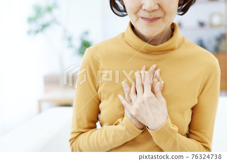 Senior woman sitting on her chest Senior woman sitting on her chest 76324738