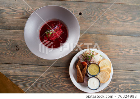 Beetrout soup with sprouts, bread and pork fat. Beetrout soup with sprouts, bread and pork fat. 76324988