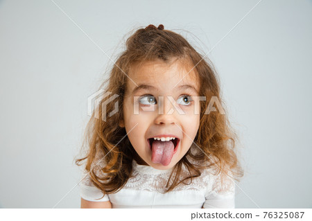 Pretty caucasian girl portrait isolated on white studio background with copyspace Pretty caucasian girl portrait isolated on white studio background with copyspace 76325087