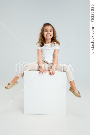 Pretty caucasian girl portrait isolated on white studio background with copyspace Pretty caucasian girl portrait isolated on white studio background with copyspace 76325089
