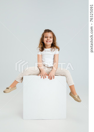 Pretty caucasian girl portrait isolated on white studio background with copyspace Pretty caucasian girl portrait isolated on white studio background with copyspace 76325091