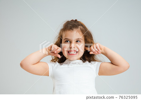 Pretty caucasian girl portrait isolated on white studio background with copyspace Pretty caucasian girl portrait isolated on white studio background with copyspace 76325095