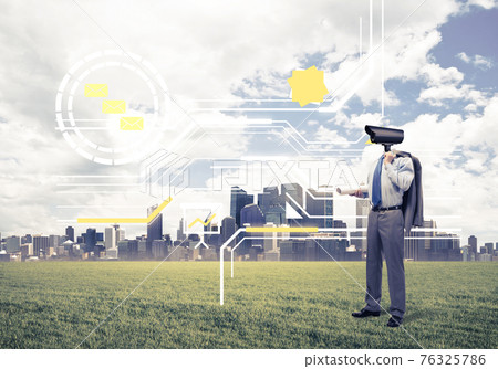 Camera headed man standing on green grass against modern citysca Camera headed man standing on green grass against modern citysca 76325786