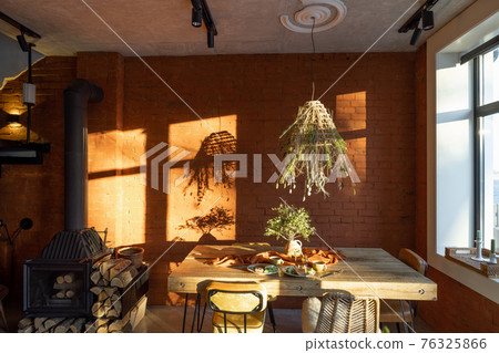 Dining place with a wooden table Dining place with a wooden table 76325866