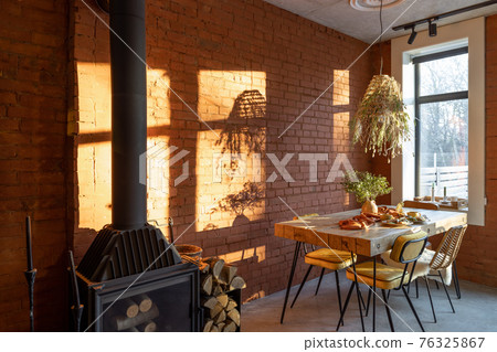 Dining place with a wooden table Dining place with a wooden table 76325867