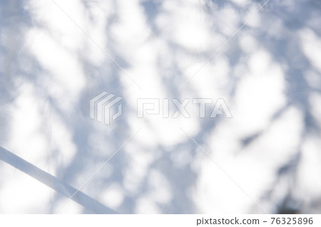 Frame of dried flowers and accessories placed on white fabric 76325896