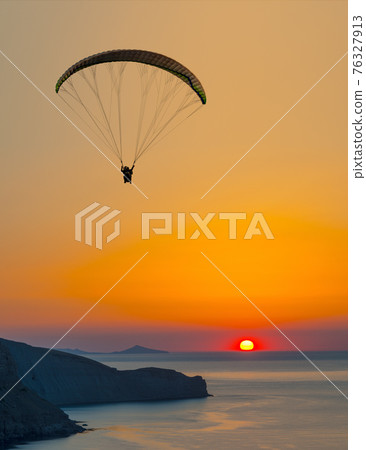 paraglider pilot fly in sky on beauty nature mountain and sea landscape 76327913