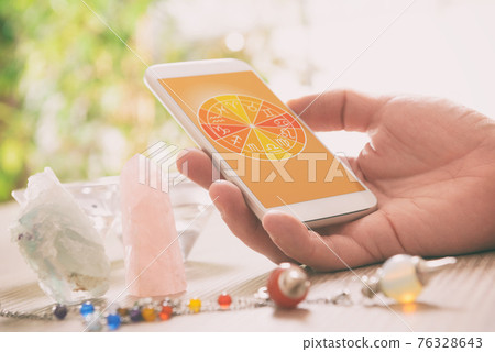 Modern astrology concept with mobile Modern astrology concept with mobile 76328643