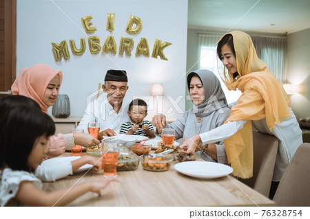 muslim asian family and grandparents having break fasting on ramadan muslim asian family and grandparents having break fasting on ramadan 76328754