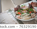 sliced raw fish 76329190