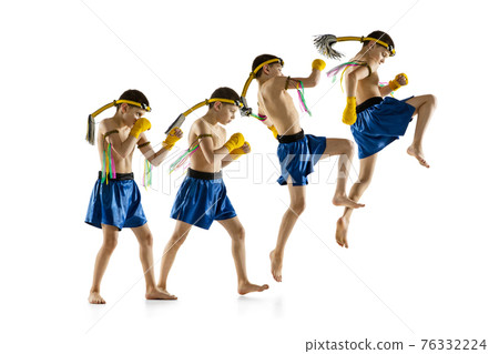 Little boy exercising thai boxing on white background. Fighter practicing, training in martial arts in action, motion. Evolution of movement, catching moment. Little boy exercising thai boxing on white background. Fighter practicing, training in martial arts in action, motion. Evolution of movement, catching moment. 76332224