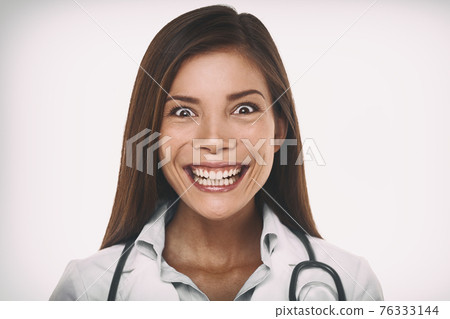 Evil smile mean psychopath doctor concept. Scary crazy Asian professional portrait woman smiling with a malicious laugh looking insane. 76333144