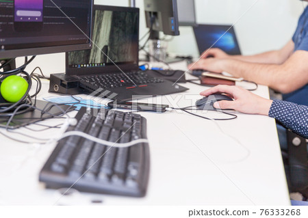 Software developer, coder or programmer working on computer Software developer, coder or programmer working on computer 76333268