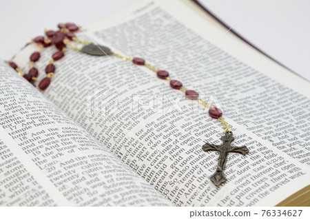 Open Bible and Rosary Open Bible and Rosary 76334627
