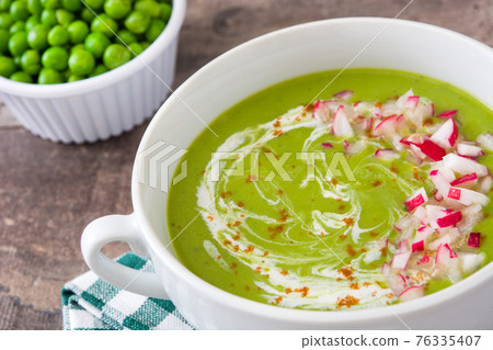 Pea soup on rustic wood Pea soup on rustic wood 76335407