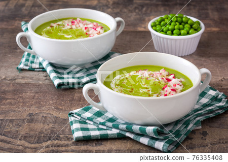 Pea soup on rustic wood Pea soup on rustic wood 76335408