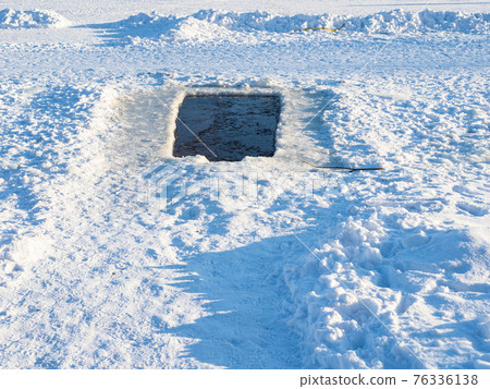 snowy footpat to large swimming ice-hole in pond snowy footpat to large swimming ice-hole in pond 76336138
