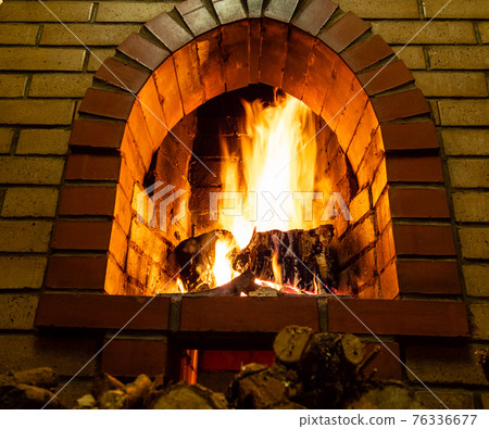 bottom view of brick fireplace with fire bottom view of brick fireplace with fire 76336677