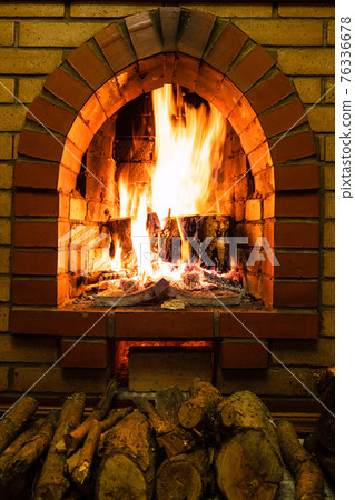 front view of brick fireplace and firewood 76336678