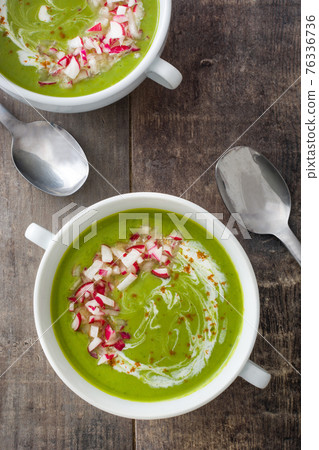 Pea soup on rustic wooden table Pea soup on rustic wooden table 76336736