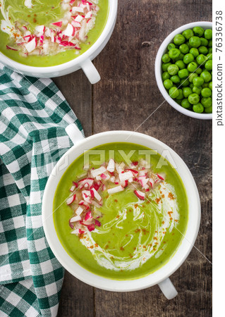 Pea soup on rustic wooden table Pea soup on rustic wooden table 76336738