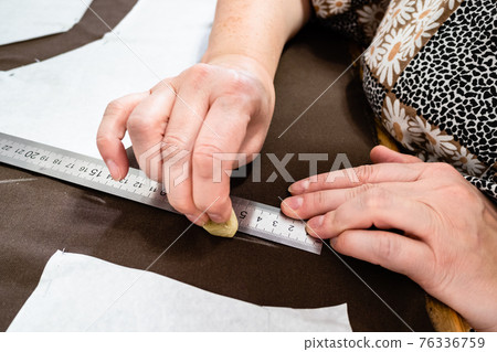 hand draws pattern on fabric by soap close up hand draws pattern on fabric by soap close up 76336759