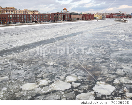 frozen Moskva River near embankment in Moscow frozen Moskva River near embankment in Moscow 76336968