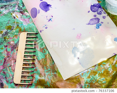 comb for marbling and wet paper on spotted surface 76337106