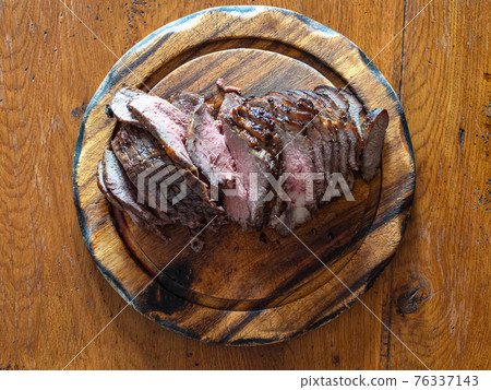 top view of home-made sliced Roast Beef on board 76337143