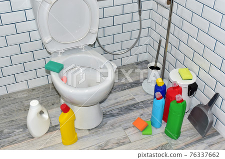 Detergent bottles and sponge for cleaning the toilet in the bathroom in home. Detergents bottles  76337662