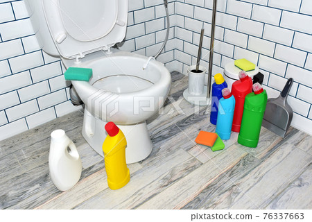 Detergent bottles and sponge for cleaning the toilet in the bathroom in home. Detergents bottles Detergent bottles and sponge for cleaning the toilet in the bathroom in home. Detergents bottles 76337663