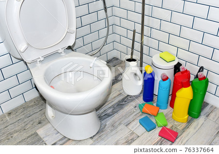 Detergent bottles and sponge for cleaning the toilet in the bathroom in home. Detergents bottles Detergent bottles and sponge for cleaning the toilet in the bathroom in home. Detergents bottles 76337664