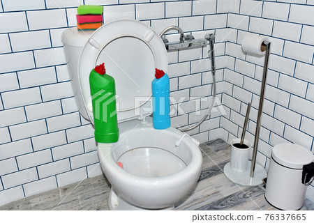 Detergent bottles and sponge for cleaning the toilet in the bathroom in home. Detergents bottles Detergent bottles and sponge for cleaning the toilet in the bathroom in home. Detergents bottles 76337665