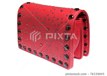 elegant red bag decorated with metal rivets, on a white background, side and top view elegant red bag decorated with metal rivets, on a white background, side and top view 76339045