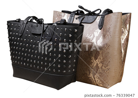 two large women's bags, one beige made of reptile skin, the other black, decorated with metal rivets two large women's bags, one beige made of reptile skin, the other black, decorated with metal rivets 76339047