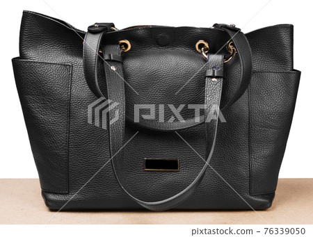 black leather ladies bag, on a white background, frontal arrangement black leather ladies bag, on a white background, frontal arrangement 76339050