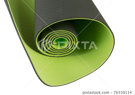 fragment of new green yoga mat, fitness or hiking, close-up, on white background 76339114