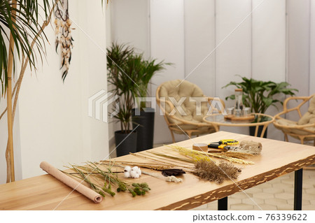 dried flowers and herbs on a table in a florist workshop dried flowers and herbs on a table in a florist workshop 76339622