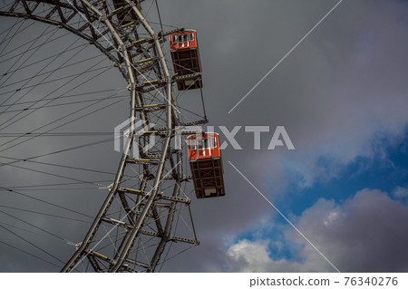 Ferris wheel in an amusement park Ferris wheel in an amusement park 76340276