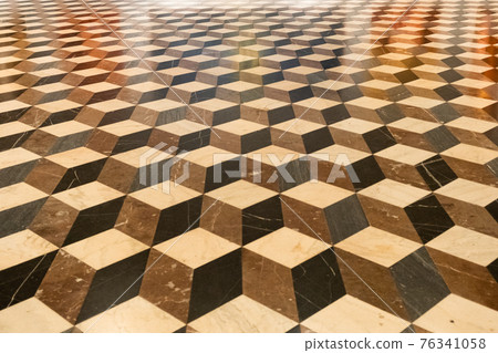 Brown, black, light rhombic texture on the floor. Rhombic slab.  76341058