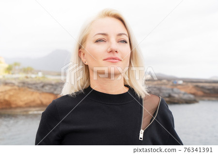 Blond girl breathing 76341391